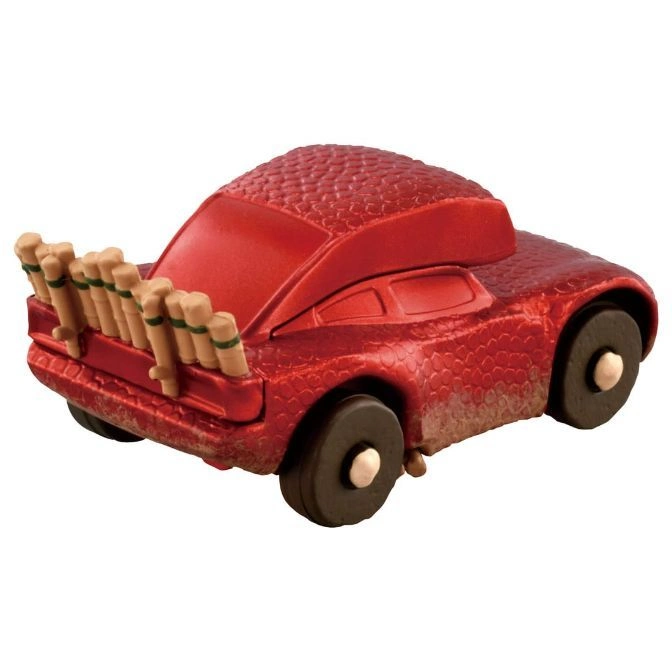  Red toy car with a scaly texture and wooden dowels attached to the back.