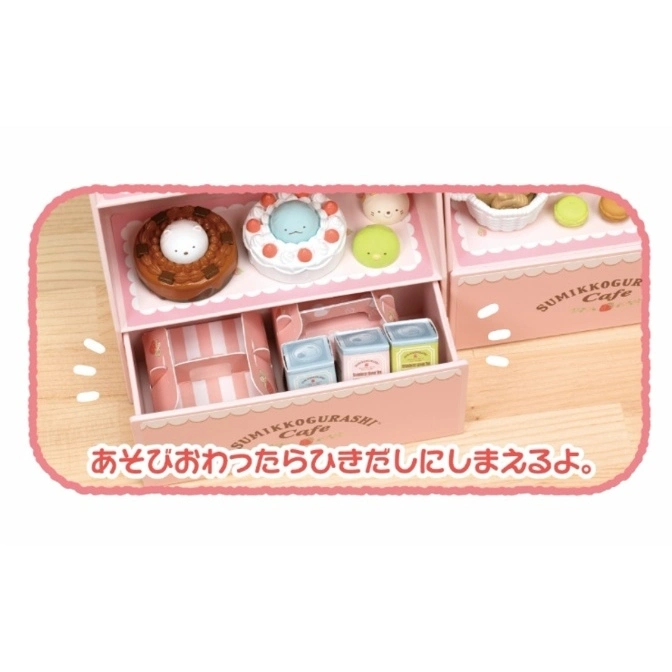  Sumikkogurashi Cafe toy set with donuts, macarons, and boxes in a pink drawer.