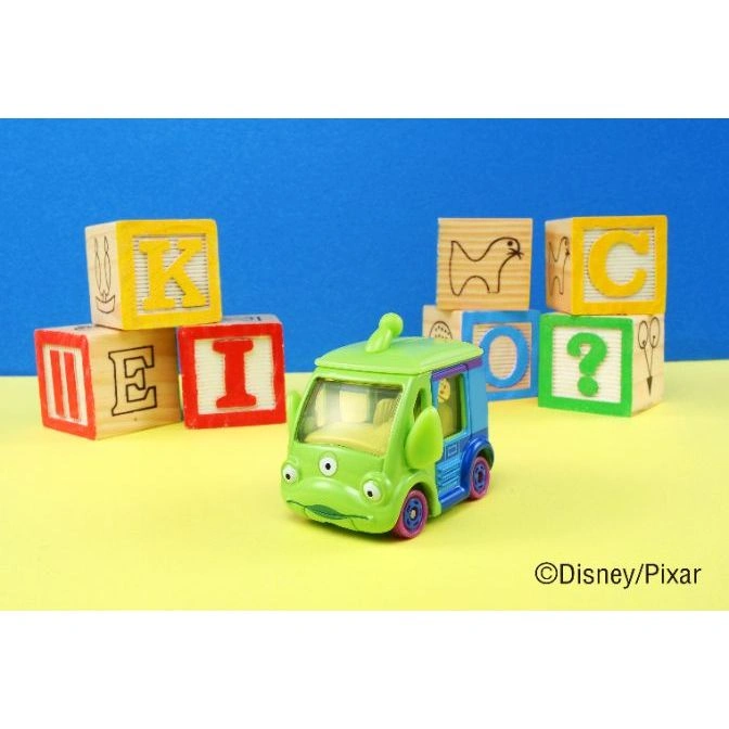  Toy Story Alien truck toy with letter blocks. Green and blue vehicle with purple wheels.